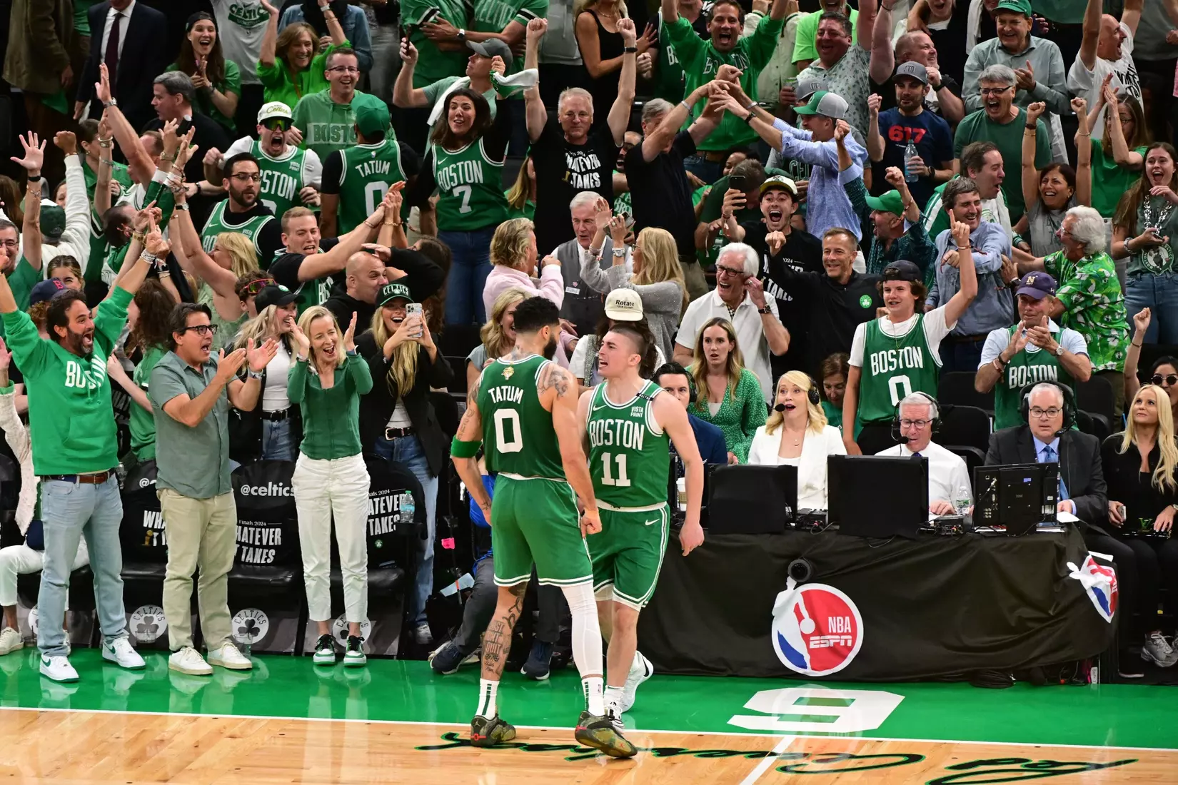 BOSTON, MA - JUNE 17: Jayson Tatum #0 of the Boston Celtics and Payton Pritchard #11 of the Boston Celtics celebrate after making a buzzer beater during the game against the Dallas Mavericks during Game Five of the 2024 NBA Finals on June 17, 2024 at the TD Garden in Boston, Massachusetts. NOTE TO USER: User expressly acknowledges and agrees that, by downloading and or using this photograph, User is consenting to the terms and conditions of the Getty Images License Agreement. Mandatory Copyright Notice: Copyright 2024 NBAE  (Photo by Adam Hagy/NBAE via Getty Images)