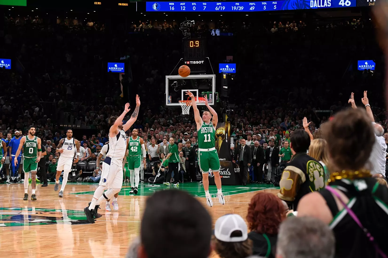 BOSTON, MA - JUNE 17: Payton Pritchard #11 of the Boston Celtics makes a buzzer beater during the game against the Dallas Mavericks during Game 5 of the 2024 NBA Finals on June 17, 2024 at the TD Garden in Boston, Massachusetts. NOTE TO USER: User expressly acknowledges and agrees that, by downloading and or using this photograph, User is consenting to the terms and conditions of the Getty Images License Agreement. Mandatory Copyright Notice: Copyright 2024 NBAE  (Photo by Brian Babineau/NBAE via Getty Images)