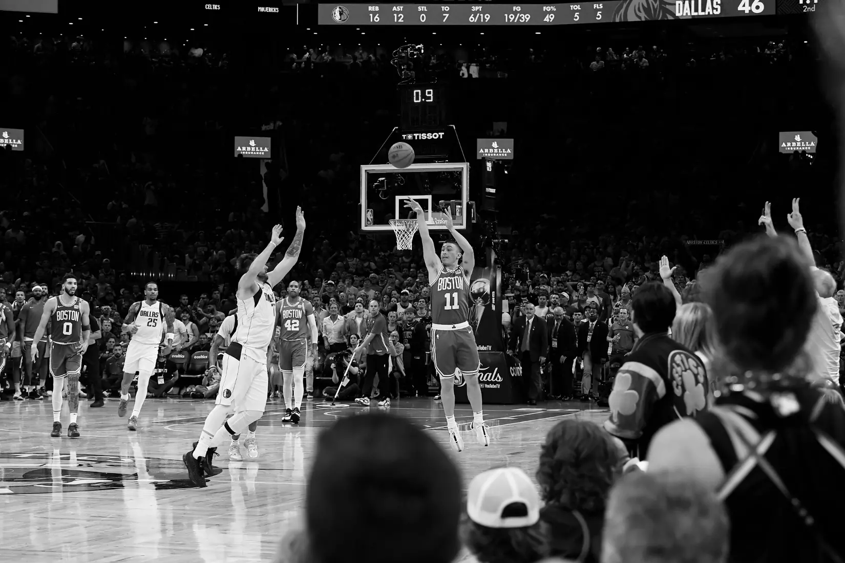 BOSTON, MA - JUNE 17: (EDITORS NOTE: this photo has been converted to black and white) Payton Pritchard #11 of the Boston Celtics makes a buzzer beater during the game against the Dallas Mavericks during Game 5 of the 2024 NBA Finals on June 17, 2024 at the TD Garden in Boston, Massachusetts. NOTE TO USER: User expressly acknowledges and agrees that, by downloading and or using this photograph, User is consenting to the terms and conditions of the Getty Images License Agreement. Mandatory Copyright Notice: Copyright 2024 NBAE  (Photo by Brian Babineau/NBAE via Getty Images)
