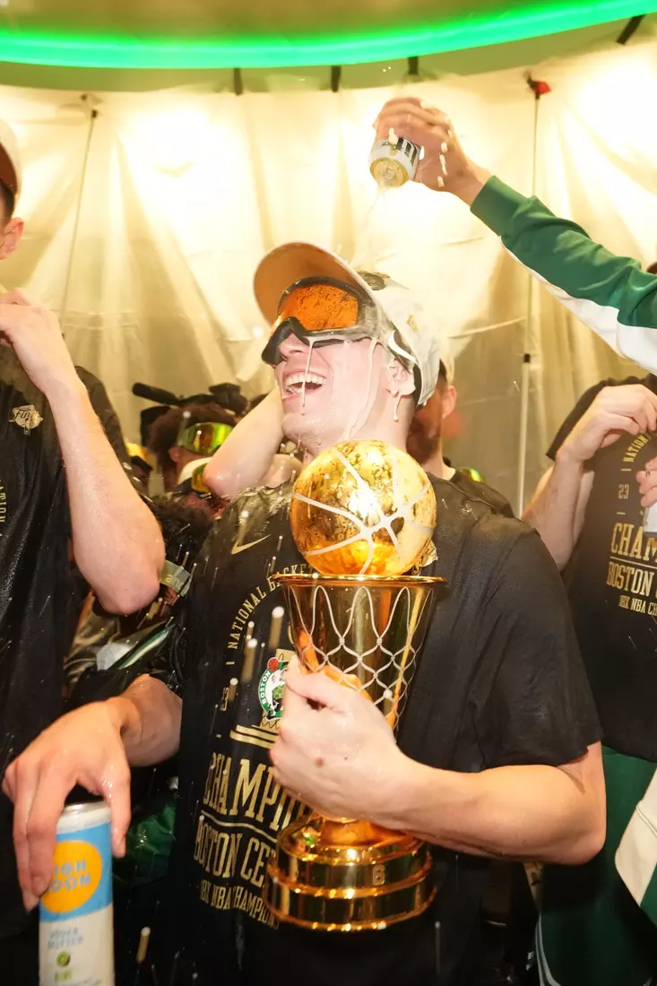 BOSTON, MA - JUNE 17: Payton Pritchard #11 of the Boston Celtics celebrates in the locker room after winning Game 5 of the 2024 NBA Finals against the Dallas Mavericks on June 17, 2024 at the TD Garden in Boston, Massachusetts. NOTE TO USER: User expressly acknowledges and agrees that, by downloading and or using this photograph, User is consenting to the terms and conditions of the Getty Images License Agreement. Mandatory Copyright Notice: Copyright 2024 NBAE  (Photo by Jesse D. Garrabrant/NBAE via Getty Images)
