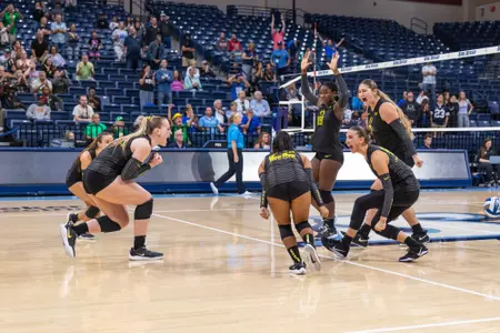 Team celebrates De Los Reyes ace vs BYU - Sept. 13