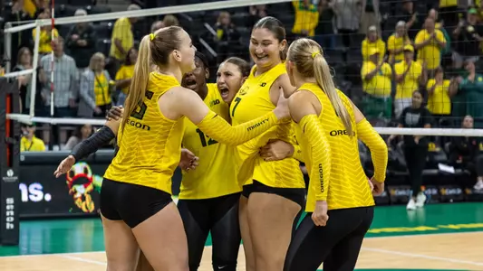 Team celebrating match point vs Indiana - Sept. 28