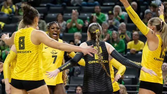 Team huddle + celebration vs Michigan (Nov. 22)