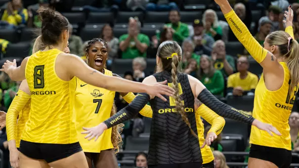 Team huddle + celebration vs Michigan (Nov. 22)