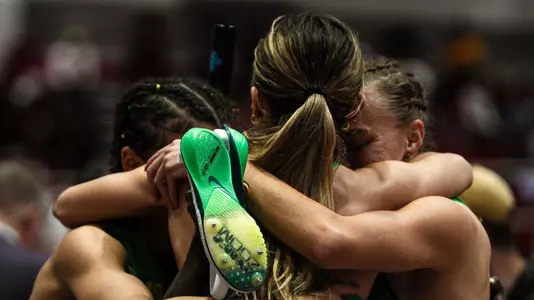 Women's DMR celebration hug (March 13)