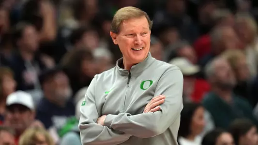 PORTLAND, OREGON - DECEMBER 21: Head coach Dana Altman of the Oregon Ducks smiles during the second half against the Gonzaga Bulldogs at Moda Center on December 21, 2025 in Portland, Oregon. (Photo by Soobum Im/Getty Images)