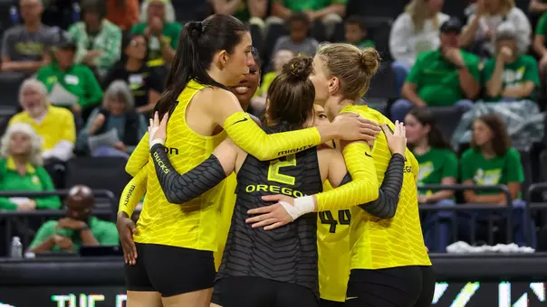 Green-Yellow celebration huddle (Aug. 2026)