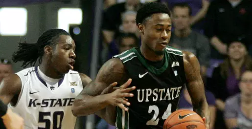 Wildcats Use First-Half Run to Roll Past Spartans Image