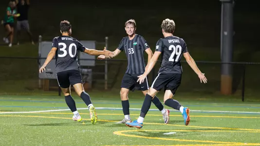 Josh Zawlocki after scoring a goal with Logan Grasso and Caedon Reynolds