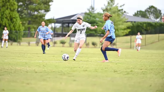 Maddie Smith dribbling vs Longwood
