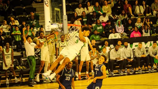 Mason Bendinger after a dunk against Bob Jones