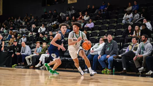 Karmani Gregory dribbling past Bob Jones (11/12/25)
