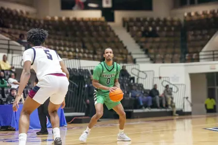 Tyler Smith going for the stepback three-pointer