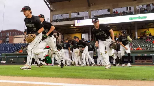 Baseball team taking the field vs Clemson - Fluor Field