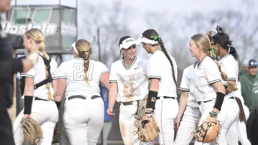 Softball Team huddle before the College of Charleston game