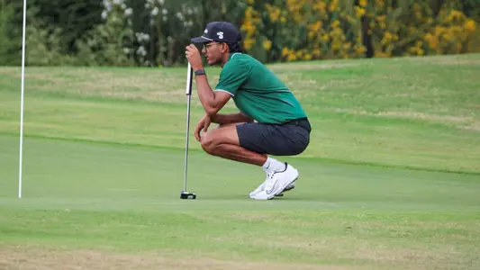 Jas Sohal Lining Up a Putt