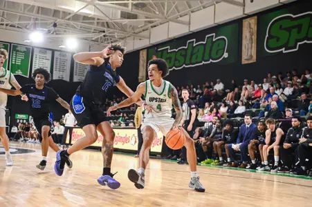 Carmelo Adkins dribbling against PC