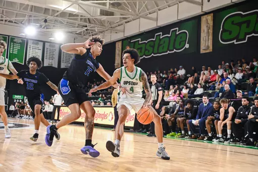 Carmelo Adkins dribbling against PC