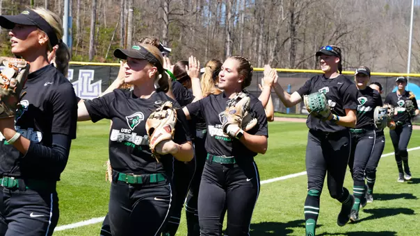 Leanne Allen and Molly Vaughn going through the huddle