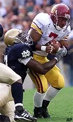 Chad Morton avoids the<br>tackle of Notre Dame<br>end Lamont Bryant during<br>the first quarter.