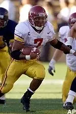 Chad Morton runs<br>through Cal defenders during<br>a second quarter run.