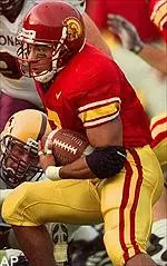 Chad Morton looks for<br>more yards after breaking<br>away from the ASU<br>line during a<br>first quarter run.