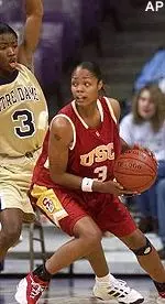 Tiffany Elmore drives the lane against Notre Dame's Ericka Haney during a first half attempt Monday night.