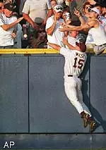 MSU's Brian Wiese competes with<br>the fans for a home run ball<br>hit by USC's Brad Ticehurst.