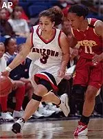 USC's Erica Mashia applies pressure to Arizona's Lisa Griffith in the backcourt.