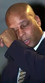 Former San Francisco 49er and USC great Ronnie Lott wipes his eyes after the announcement of his election to the Pro Football Hall of Fame Saturday Jan. 29, 2000 in Atlanta.