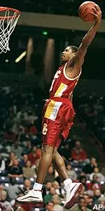 Jeff Trepagnier gets up for a slam dunk in the Trojans easy win over Washington State Thursday night.
