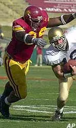 Notre Dame's Matt LoVecchio is tackled by USC's Nathan Goodson.