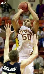 USC's Sam Clancy shoots over Brigham Young's Eric Nielsen in the second half Saturday.