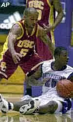 USC's Brandon Granville prepares to steal the ball back from Northwestern's Jitim Young  in the first half.