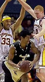 LBSU's Lemi Williams is pressured by Desmon Farmer and Brian Scalabrine during the first half at the Sports Arena.
