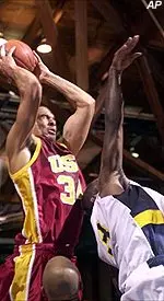 David Bluthenthal rips a rebound away from UC Santa Barbara's LaRon Bryant during the first half.