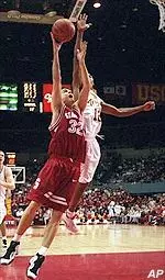 Jeff Trepagnier goes up to contest the shot of Stanford's Ryan Mendez on Saturday.