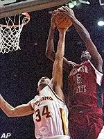David Bluthenthal blocks Washington State forward Milton Riley in the first half of the Trojans' victory over the Cougars.