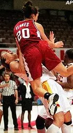 USC's Carmen Krause draws the charge from Stanford's Milena Flores in the first half.
