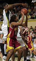 USC's Denise Woods looks to shoot as Oregon's Alyssa Fredrick tries to block her shot during the Trojans' 55-53 win.