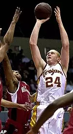 Brian Scalabrine takes a shot over Washington State forward Eddie Miller during the first half.