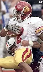 Kelly Kareem is tackled by Arizona's Jermaine Chatman after a gain of 6 yards in the first quarter.