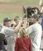 Randy Johnson (right) added another award to his World Series co-MVP honor by winning the Cy Young award on Tuesday