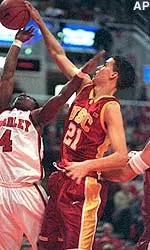 Rory O'Neil blocks a shot by Bradley's Marcello Robinson's during the first half.