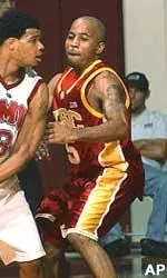 Brandon Granville defends against LMU's Kent Dennis in the first half Saturday night.