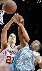 Rhode Island's Brian Woodward and Rory O'Neil battle for a rebound during the first half.