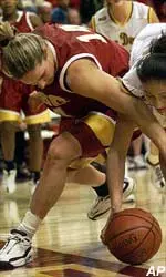 USC's Carmen Krause battles for a loose ball with ASU's Cian Carvalho during Thursday night's game.