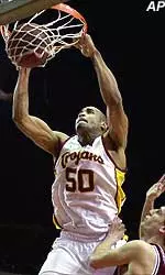 Sam Clancy slams through two of his 16 points over Stanford's Ryan Mendez during Thursday night's game.