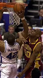 Sam Clancy ties up Kentucky's Jason Parker during the first half of their NCAA East Regional Semifinal in Philadelphia.