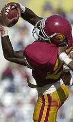 Trojan cornerback Chris Cash, shown intercepting a pass against San Jose State, will be put to the test against Oregon's Joey Harrington, a Heisman candidate at QB.
